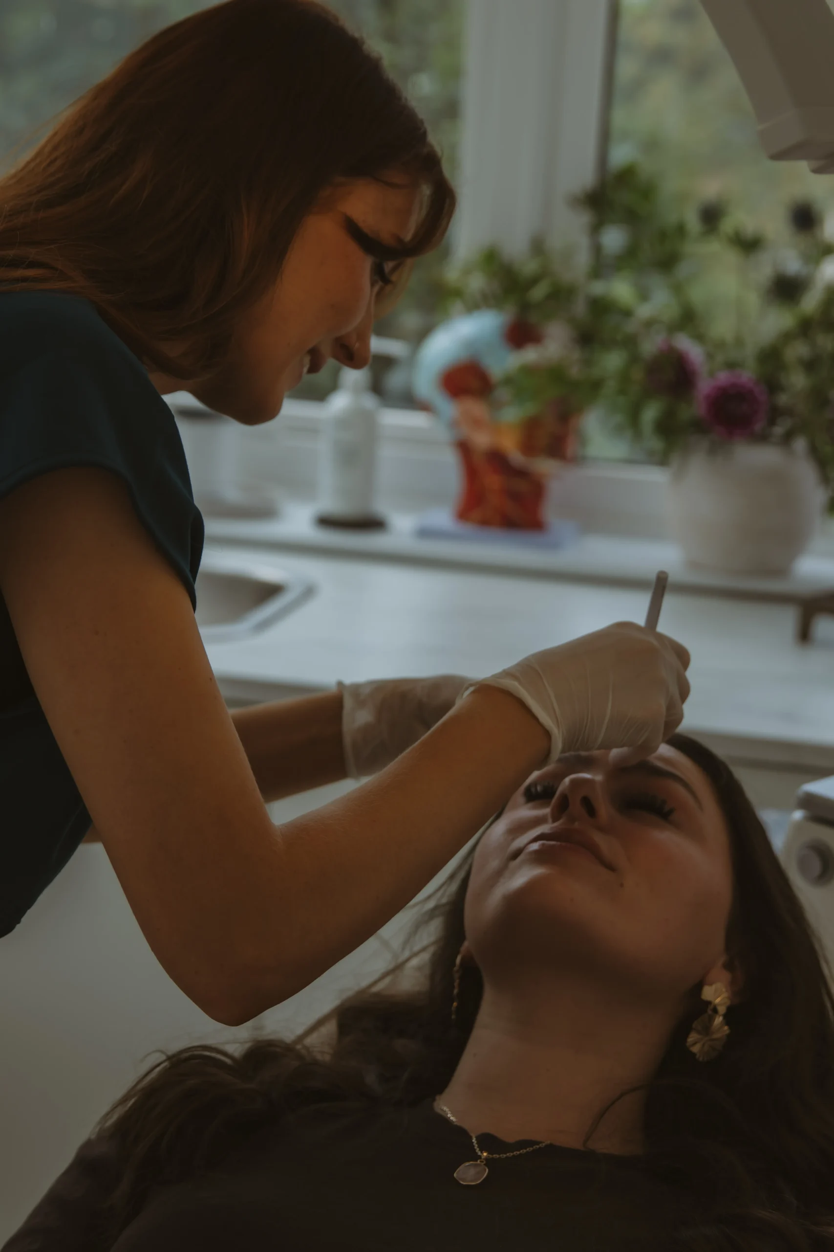 Jasmine administering a precise injectable facial treatment