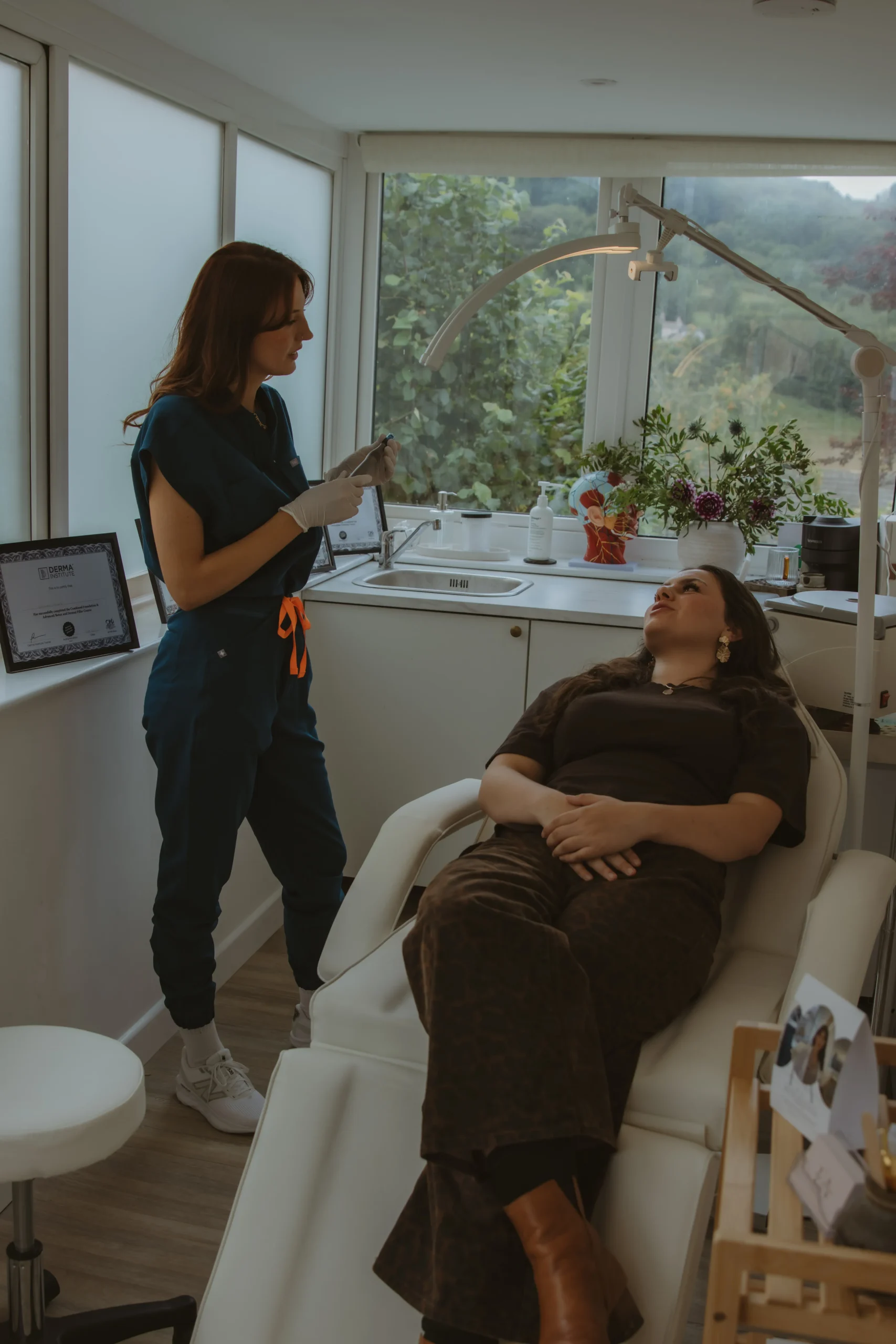 Jasmine explaining personalised treatment options to a client